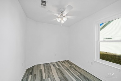 Live lakefront at Leisure Lake, a coveted Foley community where on Glenlakes Golf Club in Alabama - for sale on GolfHomes.com, golf home, golf lot