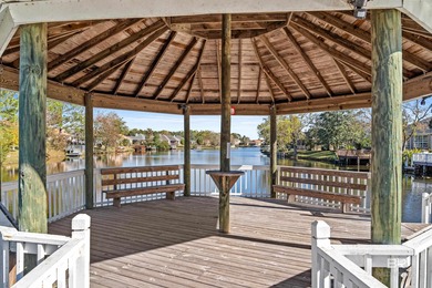 Live lakefront at Leisure Lake, a coveted Foley community where on Glenlakes Golf Club in Alabama - for sale on GolfHomes.com, golf home, golf lot