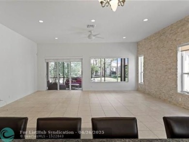 Welcome to this stunning three-bedroom, two-and-a-half-bathroom on Heron Bay Golf Club in Florida - for sale on GolfHomes.com, golf home, golf lot