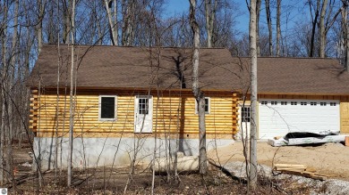 Enjoy life in the heart of Leelanau County in your brand new log on Manitou Passage Golf Club in Michigan - for sale on GolfHomes.com, golf home, golf lot