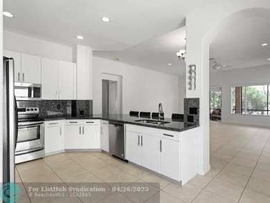 Welcome to this stunning three-bedroom, two-and-a-half-bathroom on Heron Bay Golf Club in Florida - for sale on GolfHomes.com, golf home, golf lot