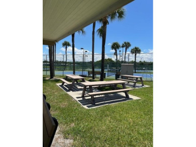 Discover the perfect blend of comfort and lifestyle in this 2/2 on Cypress Lakes Golf Course - West Palm Beach in Florida - for sale on GolfHomes.com, golf home, golf lot