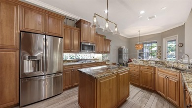 Enjoy luxurious comfort in this beautifully designed and on University Park Country Club in Florida - for sale on GolfHomes.com, golf home, golf lot