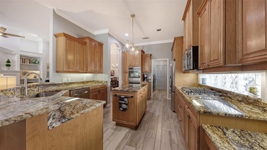 Enjoy luxurious comfort in this beautifully designed and on University Park Country Club in Florida - for sale on GolfHomes.com, golf home, golf lot