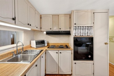 Perfectly positioned in the highly desirable community of on Bay Tree Golf Course in Florida - for sale on GolfHomes.com, golf home, golf lot