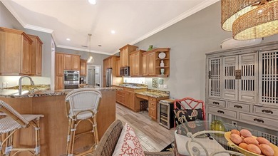 Enjoy luxurious comfort in this beautifully designed and on University Park Country Club in Florida - for sale on GolfHomes.com, golf home, golf lot