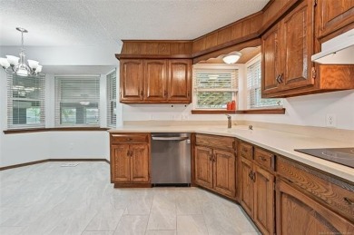 This spacious home sits on a fully fenced 0.61-acre lot and on Forest Ridge Golf Club in Oklahoma - for sale on GolfHomes.com, golf home, golf lot