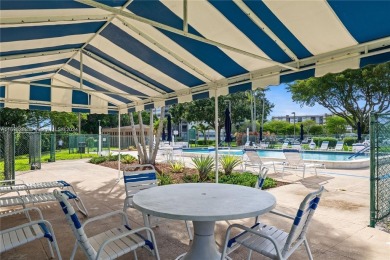 Lovely condo offers a perfect blend of comfort and convenience on Pembroke Lakes Golf Club in Florida - for sale on GolfHomes.com, golf home, golf lot