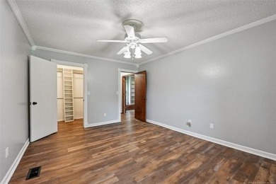 This spacious home sits on a fully fenced 0.61-acre lot and on Forest Ridge Golf Club in Oklahoma - for sale on GolfHomes.com, golf home, golf lot
