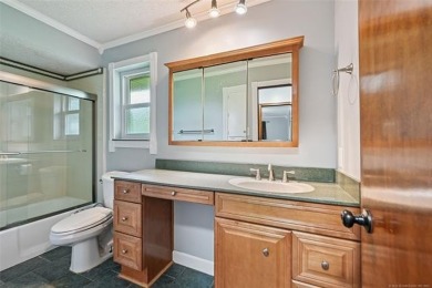 This spacious home sits on a fully fenced 0.61-acre lot and on Forest Ridge Golf Club in Oklahoma - for sale on GolfHomes.com, golf home, golf lot