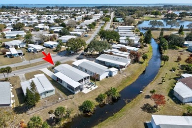 Wow! A custom 1404 sqft canal home close to the main pool! Built on Barefoot Bay Golf Course in Florida - for sale on GolfHomes.com, golf home, golf lot