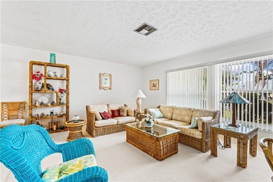 Beautifully maintained concrete block home with split plan on The American Golf Club in Florida - for sale on GolfHomes.com, golf home, golf lot