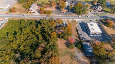 Nice land just off busy intersection with commercial potential on The Greens At North Hills Country Club in Arkansas - for sale on GolfHomes.com, golf home, golf lot