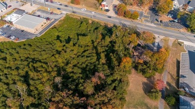 Nice land just off busy intersection with commercial potential on The Greens At North Hills Country Club in Arkansas - for sale on GolfHomes.com, golf home, golf lot