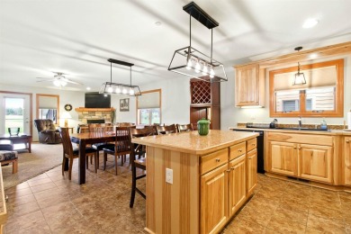 Pride of ownership is evident in this meticulously maintained on Northern Bay Golf Resort and Marina in Wisconsin - for sale on GolfHomes.com, golf home, golf lot