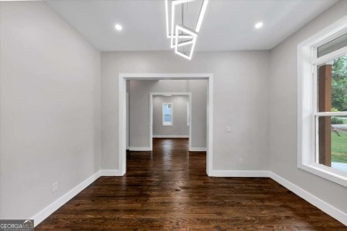 Step into flawless modern luxury at this brand-new custom-built on East Lake Golf Club in Georgia - for sale on GolfHomes.com, golf home, golf lot