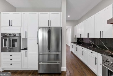 Step into flawless modern luxury at this brand-new custom-built on East Lake Golf Club in Georgia - for sale on GolfHomes.com, golf home, golf lot
