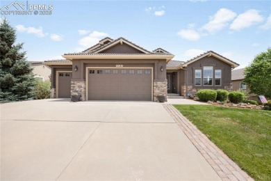 This stunning home offers four bedrooms and three bathrooms with on The Club At Flying Horse in Colorado - for sale on GolfHomes.com, golf home, golf lot