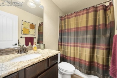 This stunning home offers four bedrooms and three bathrooms with on The Club At Flying Horse in Colorado - for sale on GolfHomes.com, golf home, golf lot
