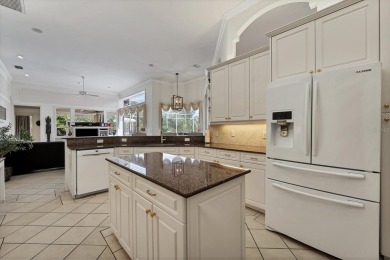 This exquisite four-bedroom home is majestically situated on the on University Park Country Club in Florida - for sale on GolfHomes.com, golf home, golf lot