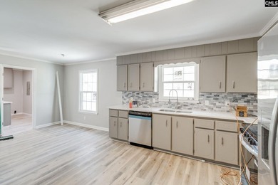 Welcome home to a single-level living space, a custom-built on The Woodlands Country Club in South Carolina - for sale on GolfHomes.com, golf home, golf lot