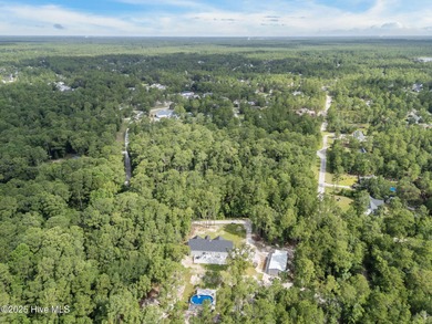 Discover the serenity of Boiling Spring Lakes with this on The Lakes Country Club in North Carolina - for sale on GolfHomes.com, golf home, golf lot
