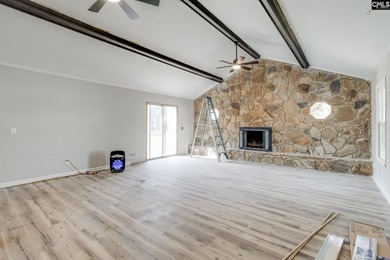 Welcome home to a single-level living space, a custom-built on The Woodlands Country Club in South Carolina - for sale on GolfHomes.com, golf home, golf lot