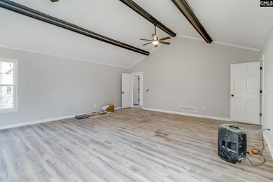 Welcome home to a single-level living space, a custom-built on The Woodlands Country Club in South Carolina - for sale on GolfHomes.com, golf home, golf lot