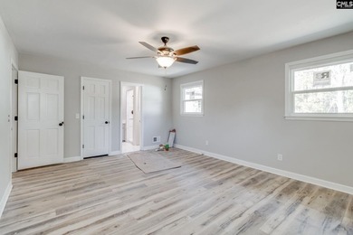 Welcome home to a single-level living space, a custom-built on The Woodlands Country Club in South Carolina - for sale on GolfHomes.com, golf home, golf lot