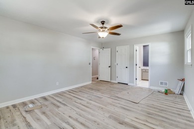 Welcome home to a single-level living space, a custom-built on The Woodlands Country Club in South Carolina - for sale on GolfHomes.com, golf home, golf lot