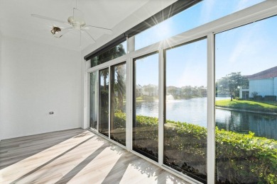 First floor coach home with stunning lake views in the exclusive on BallenIsles Golf and Country Club in Florida - for sale on GolfHomes.com, golf home, golf lot