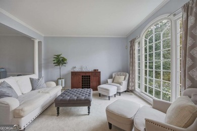 Welcome to this 5-bedroom home that sits on a corner lot and on Towne Lake Hills Golf Club in Georgia - for sale on GolfHomes.com, golf home, golf lot