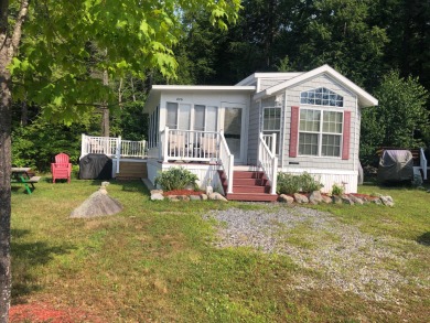 This two bedroom, 1.5 half bath Park Model is located in highly on Point Sebago Golf/Beach Resort in Maine - for sale on GolfHomes.com, golf home, golf lot
