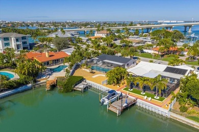 Waterfront living at its finest on highly desirable Vina Del Mar on Isla Del Sol Yacht and Country Club in Florida - for sale on GolfHomes.com, golf home, golf lot
