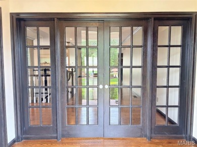 Custom ranch adjacent to the driving range in the Legends! on Country Club at the Legends in Missouri - for sale on GolfHomes.com, golf home, golf lot