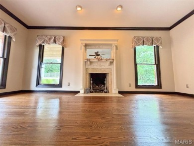Custom ranch adjacent to the driving range in the Legends! on Country Club at the Legends in Missouri - for sale on GolfHomes.com, golf home, golf lot