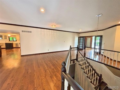 Custom ranch adjacent to the driving range in the Legends! on Country Club at the Legends in Missouri - for sale on GolfHomes.com, golf home, golf lot