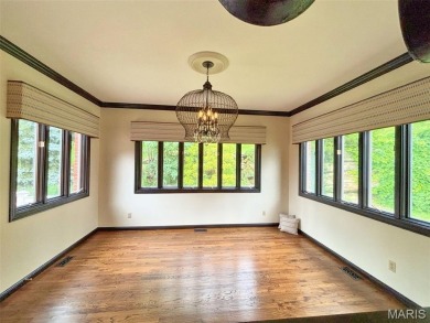 Custom ranch adjacent to the driving range in the Legends! on Country Club at the Legends in Missouri - for sale on GolfHomes.com, golf home, golf lot