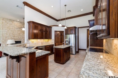 This beautiful custom home on the golf course in Hideaway Lake on Hide-A-Way Lake Golf Course in Texas - for sale on GolfHomes.com, golf home, golf lot