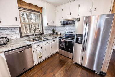 This updated 4-bedroom, 3-bath home is tucked into the Bent Tree on Bent Tree Golf Course in Georgia - for sale on GolfHomes.com, golf home, golf lot