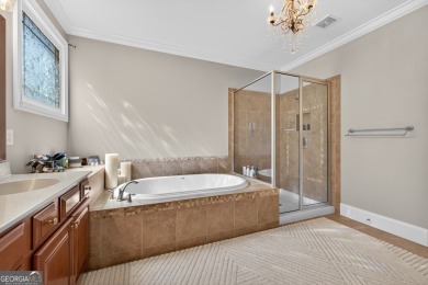 Located within the exclusive Reunion Country Club, this on Reunion Golf Club in Georgia - for sale on GolfHomes.com, golf home, golf lot