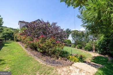 Located within the exclusive Reunion Country Club, this on Reunion Golf Club in Georgia - for sale on GolfHomes.com, golf home, golf lot