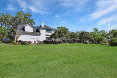 Welcome to this exquisite 5,360 sq. ft. Southern-style estate on Haile Plantation Golf and Country Club in Florida - for sale on GolfHomes.com, golf home, golf lot