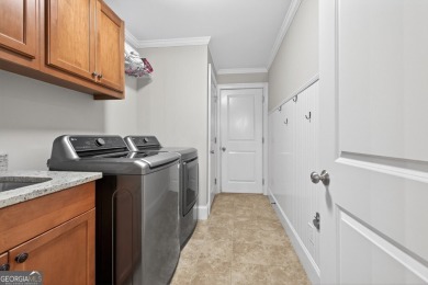 Located within the exclusive Reunion Country Club, this on Reunion Golf Club in Georgia - for sale on GolfHomes.com, golf home, golf lot