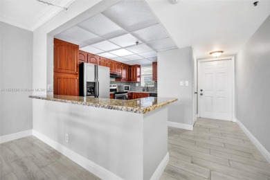 Remodeled apartment with stunning golf course and lake views! on Grande Oaks Golf Club in Florida - for sale on GolfHomes.com, golf home, golf lot