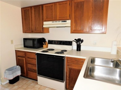 First floor end unit condo located in the Woodlake Run area of on East Lake Woodlands Country Club in Florida - for sale on GolfHomes.com, golf home, golf lot