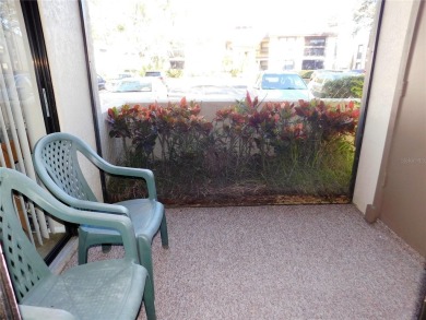 First floor end unit condo located in the Woodlake Run area of on East Lake Woodlands Country Club in Florida - for sale on GolfHomes.com, golf home, golf lot