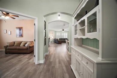 BOND PAID! STUNNING TURNKEY SOMERSET MODEL WITH GOLF CART on The Links of Spruce Creek in Florida - for sale on GolfHomes.com, golf home, golf lot