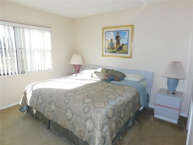 First floor end unit condo located in the Woodlake Run area of on East Lake Woodlands Country Club in Florida - for sale on GolfHomes.com, golf home, golf lot