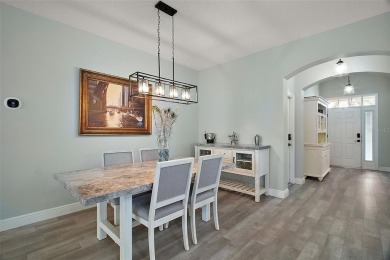 BOND PAID! STUNNING TURNKEY SOMERSET MODEL WITH GOLF CART on The Links of Spruce Creek in Florida - for sale on GolfHomes.com, golf home, golf lot
